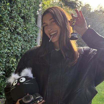 Hailey Bieber wears Gap jeans and a Saint Laurent bomber jacket at Bella Hadid's birthday party