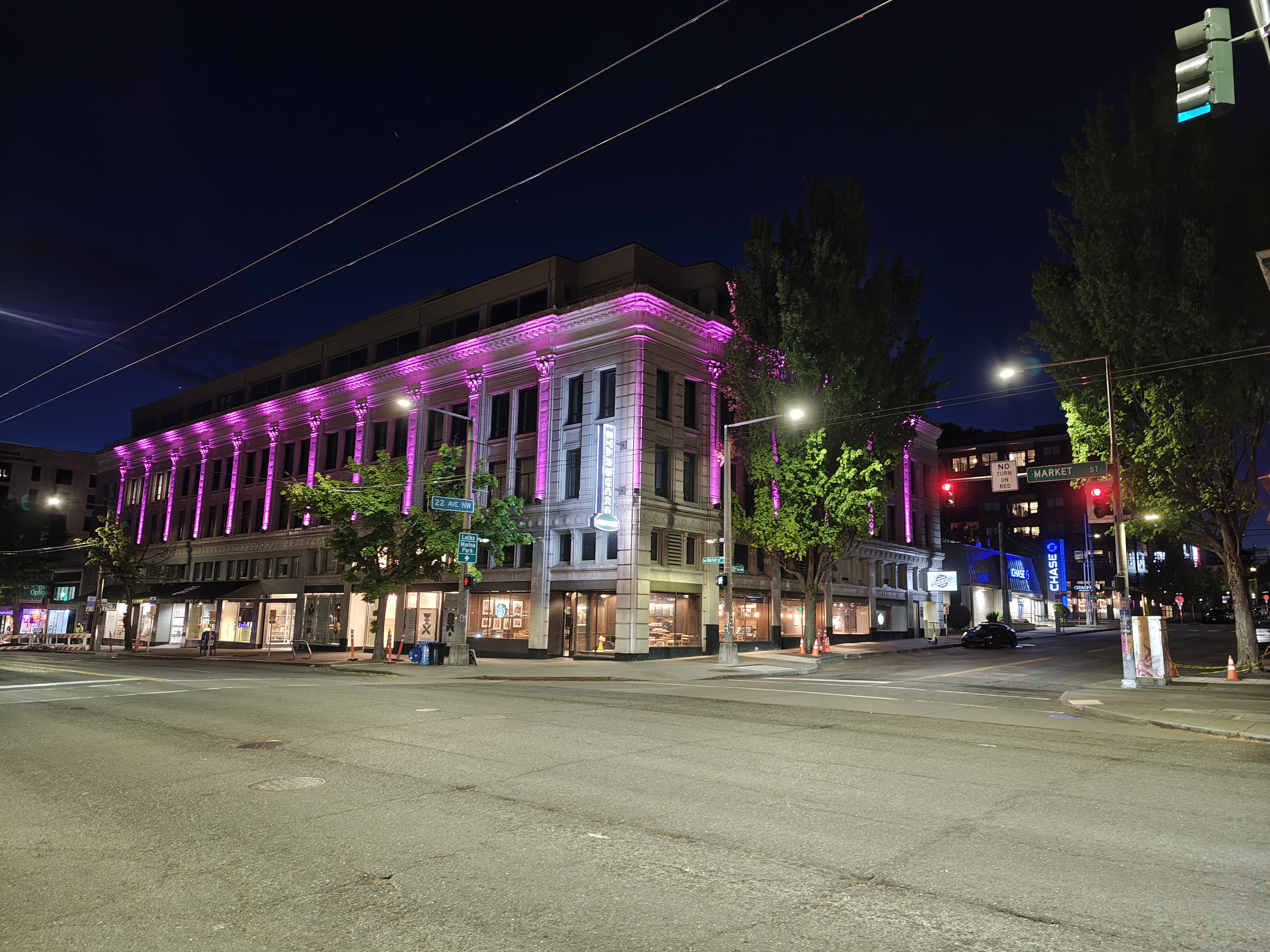 A building lit up a night with purple lights