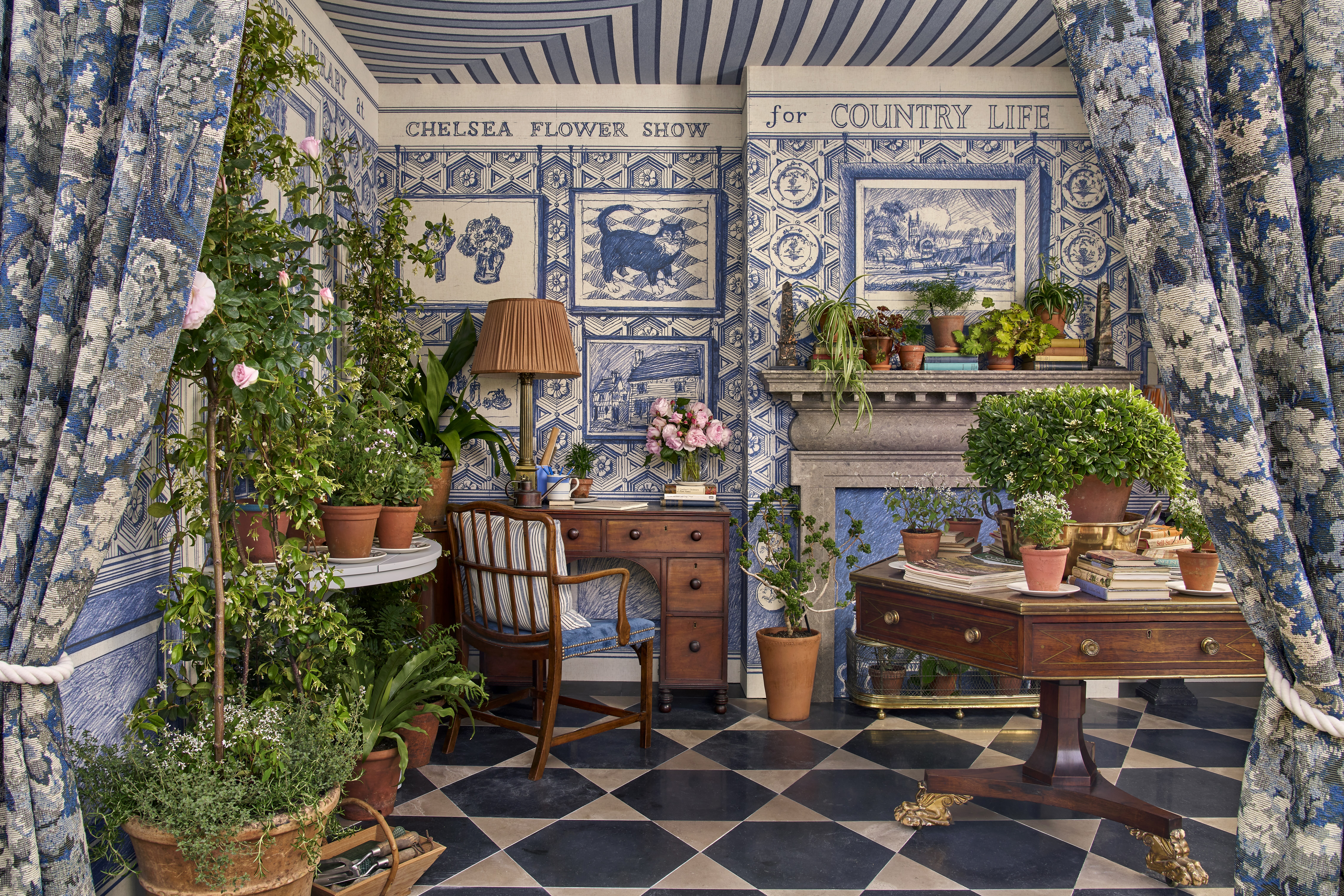 A look at the inside of the Country Life stand at RHS chelsea, with decorative wallpapersl, british stone floors and floral curtains