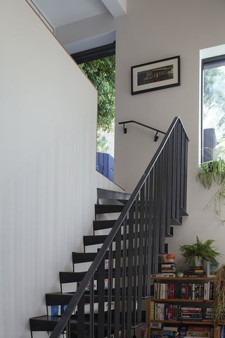 metal staircase in stepped house by vppr