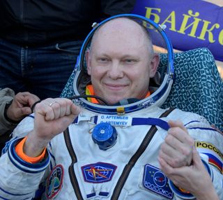 close-up of russian cosmonaut oleg artemyev in his spacesuit shortly after a landing