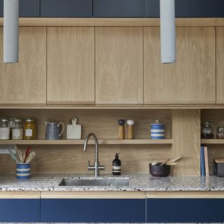 Navy and oak kitchen with open shelving