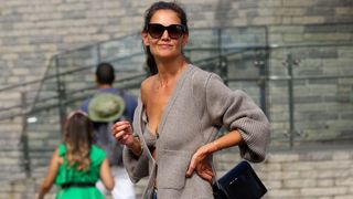 Katie Holmes shows major cleavage while hailing cab with Suri Cruise in NYC