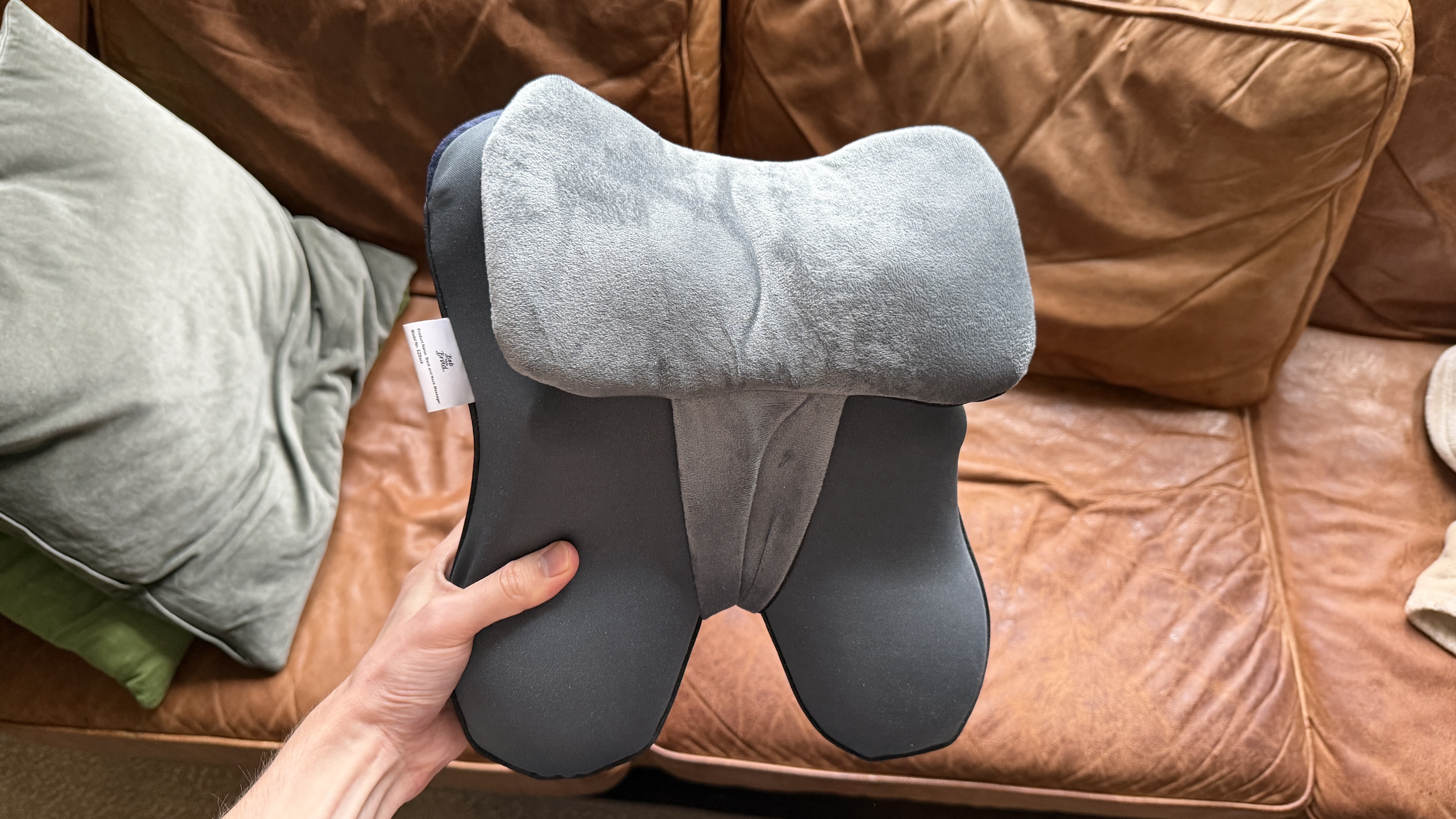 The Bob and Brad EZBack massager being held in the hand
