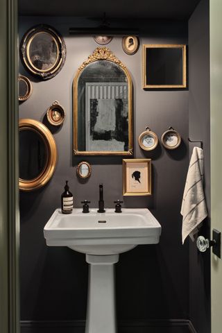 gallery wall ideas with gallery wall of vintage mirrors against black painted wall