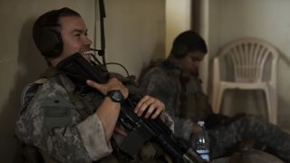 Will Poulter laughing in Warfare