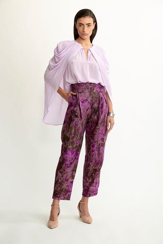 woman wearing patterned purple pants