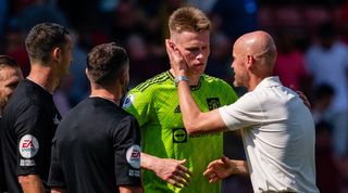 Manchester United's Scott McTominay with manager Erik ten Hag and the match officials after the Premier League game at Southampton.