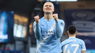Erling Haaland of Man City celebrates scoring a goal during a Premier League match.