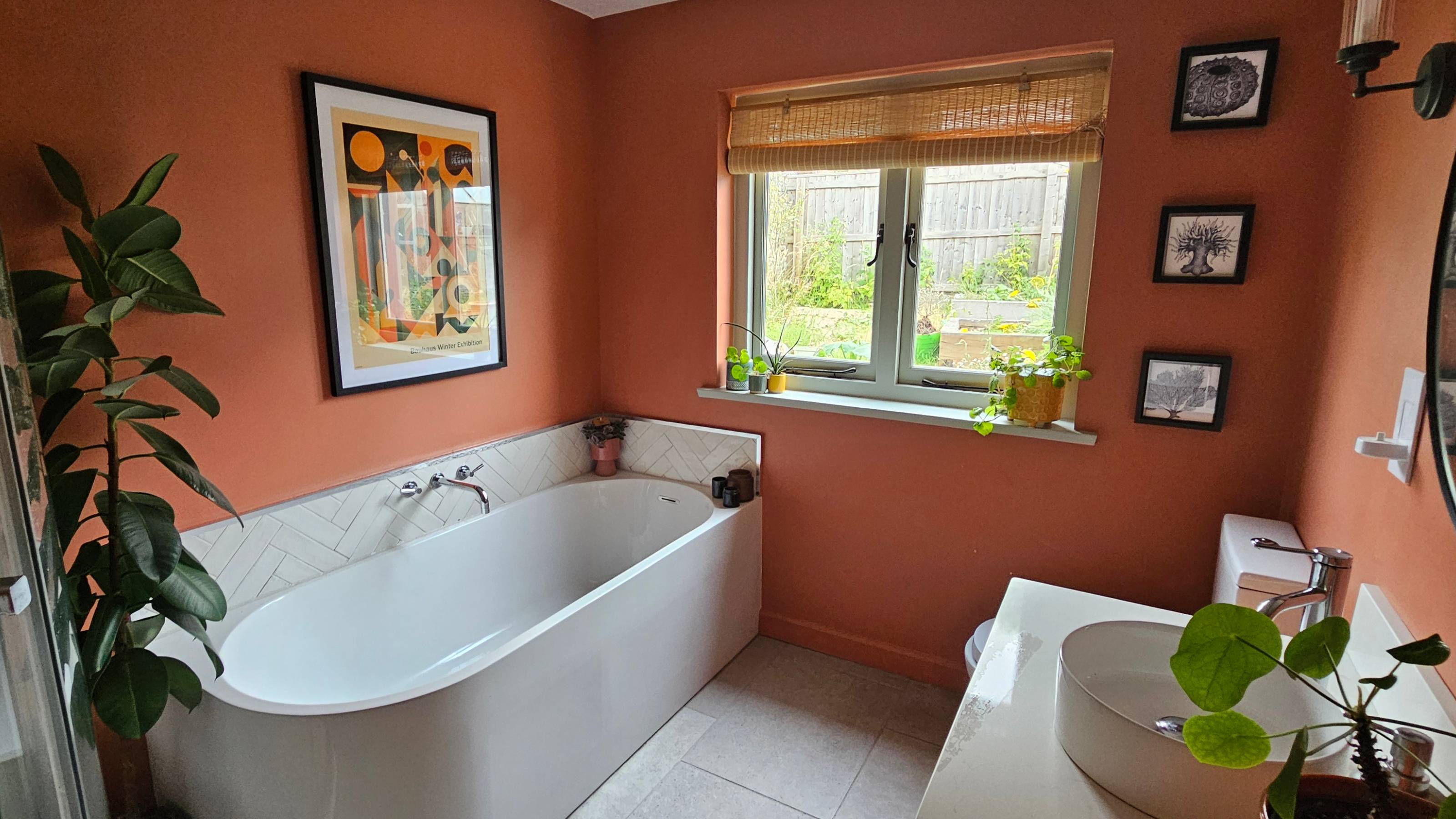 red bathroom with white suite and blue window