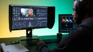 Best free video editing software - Man editing on desktop computer