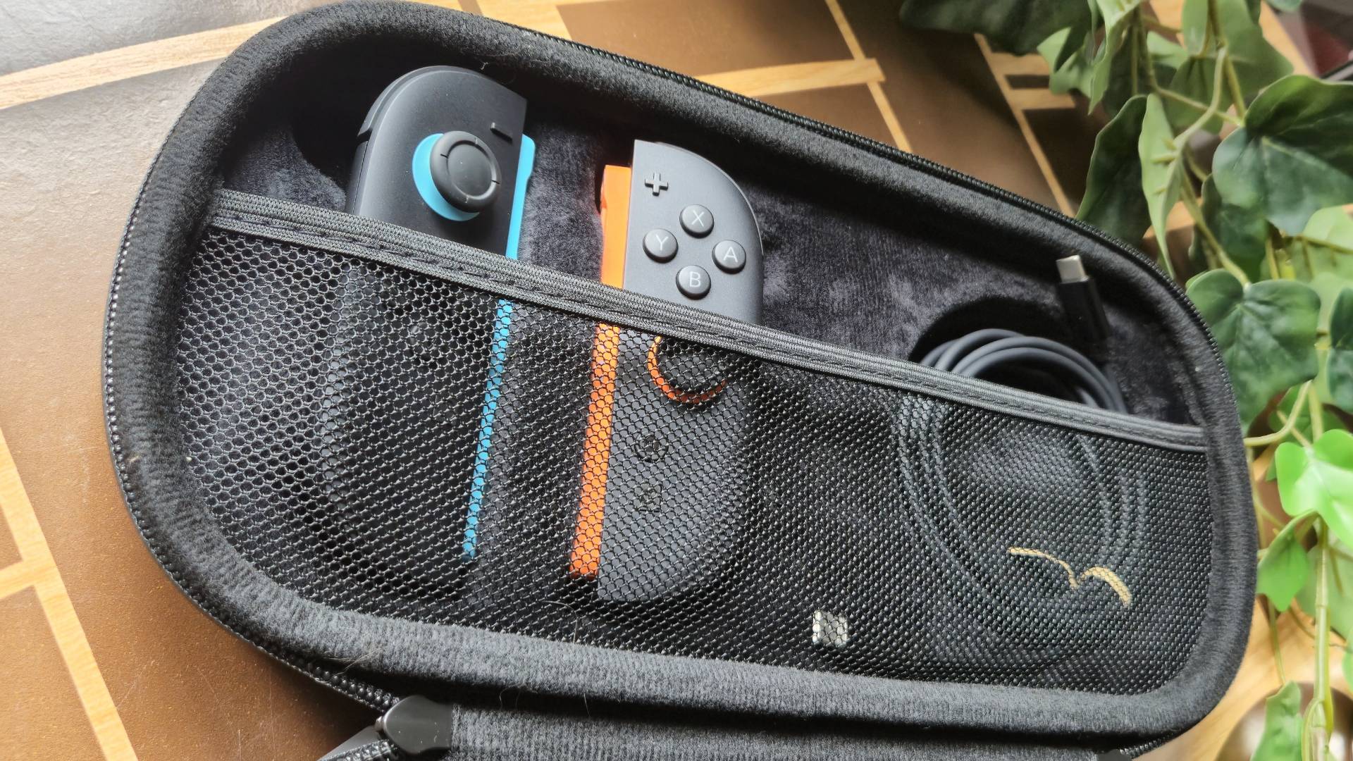 Photo by Rosalie Newcombe of the STEALTH Premium Travel Case with a pair of Joy-Con 2 controllers sitting in it.
