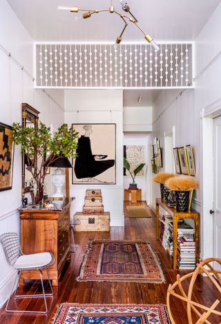 A cozy hallway with eclectic decoration and mostly wooden furnishings