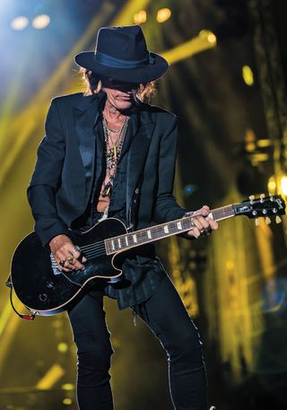 Joe Perry performs with a one-off Gibson Custom Les Paul; it has one humbucker and a Wilkinson tremolo