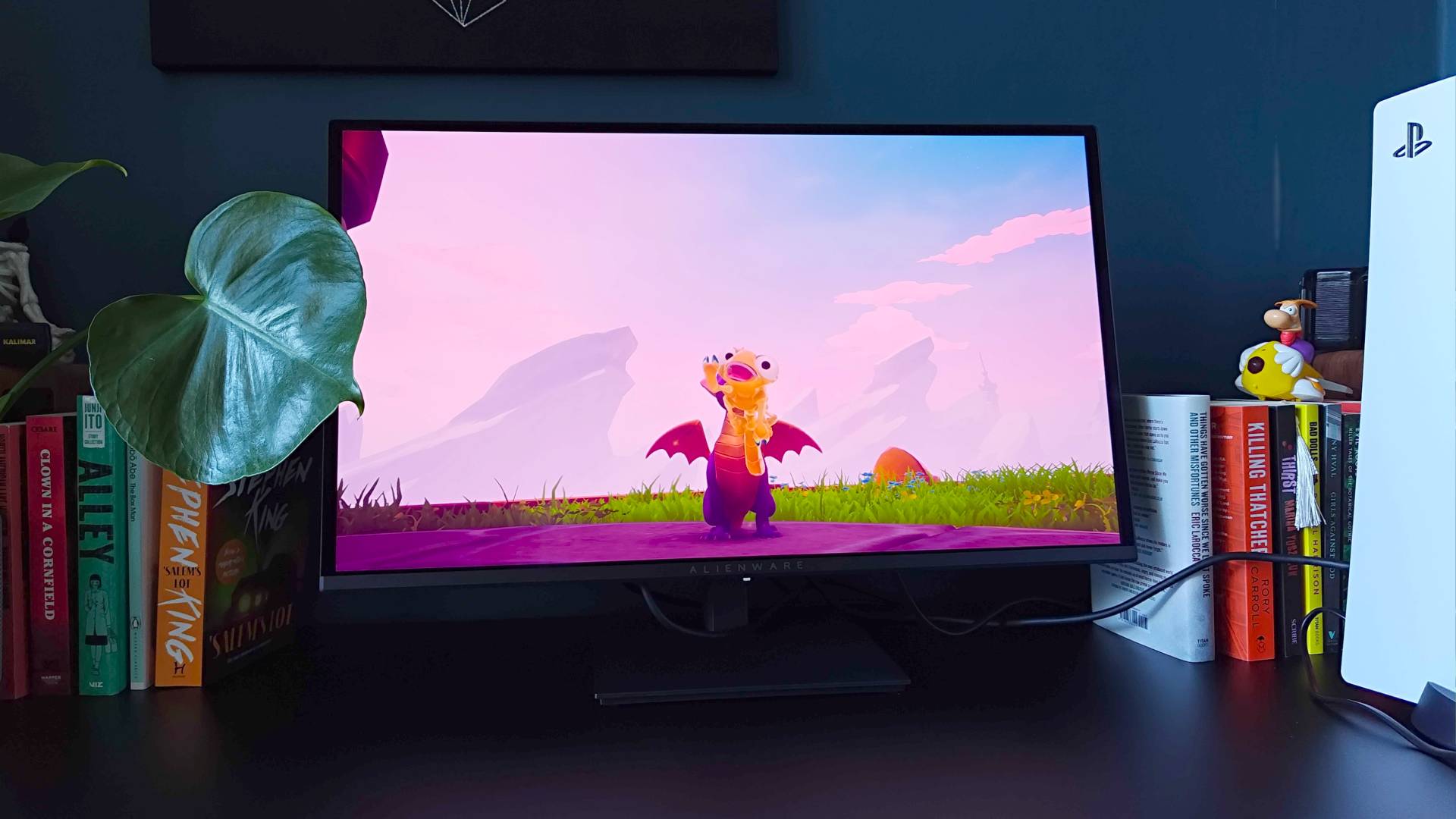 Alienware AW2726DM monitor with Spyro the Dragon gameplay on screen.