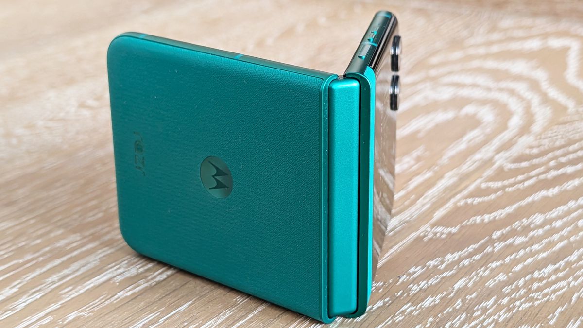 Motorola Razr 2026 in blue, being held in the hand