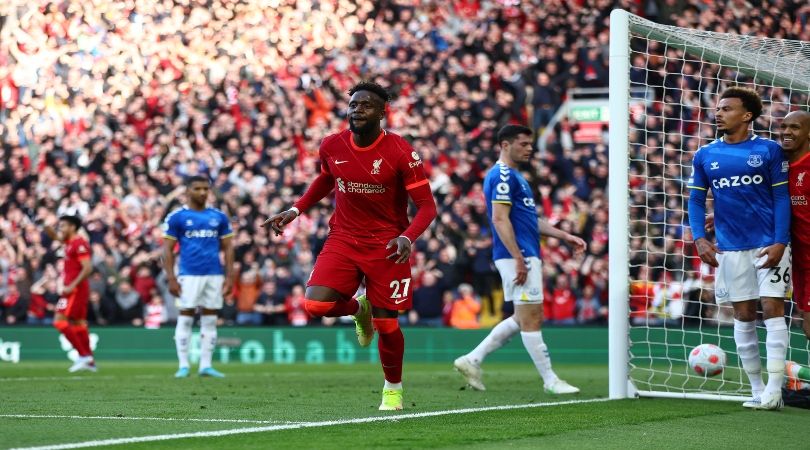 Divock Origi celebrates scoring for Liverpool against Everton.