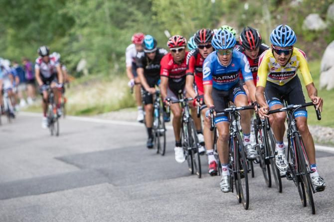 The field starts to split into smaller groups on the final climb.