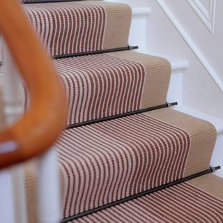 carpet on stariway with stair runner and white wall