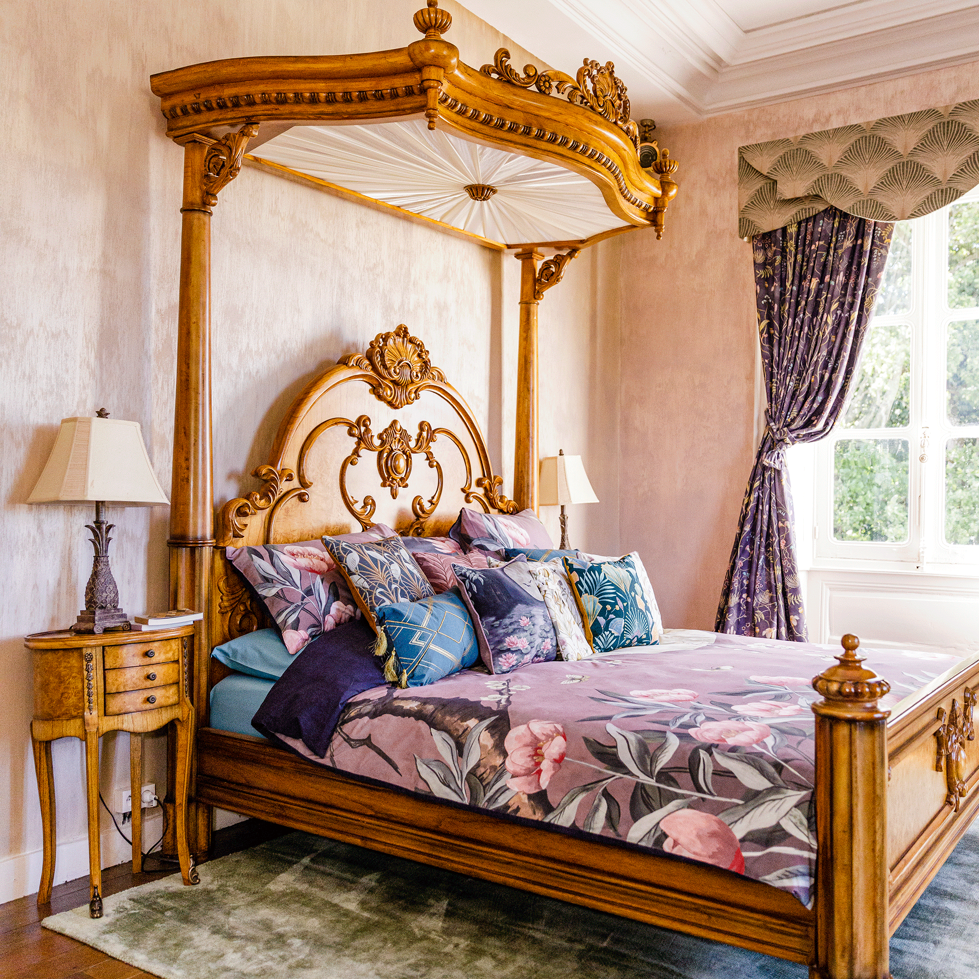 Wooden bed with patterned bedding and curtains