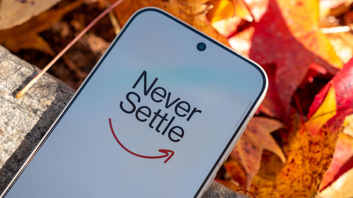 OnePlus's Never Settle logo on a OnePlus 15's display