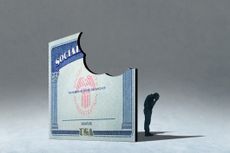 A male senior stands in the shadow of a Social Security card with bite missing.
