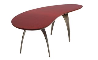 'Scarabée' Bureau, by Damien Langlois-Meurinee, for Gallery Pouenat. A curved burgundy table with black curved legs.