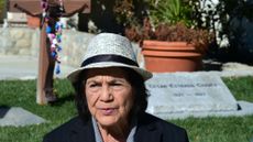 American labour leader and civil rights activist Dolores Huerta visits the graves of Cesar and Helen Chavez at the Ceasar Chavez National Monument in Keene, California on January 31, 2017, in the foothills of the Tehachapi Mountains at the southern end of central California's San Joaquin Valley. Huerta, 86, the subject of Peter Bratt's documentary "Dolores", celebrating the accomplishments of her eventful and still-active life, officially began her career as an activist in 1955 by helping Frank Ross start the Stockton, California Chapter of the Community Service Organization, which fought for economic improvements for Latinos. In 1962, she co-founded the National Farm Workers Association with labour leader and civil rights activist C&eacute;sar Ch&aacute;vez, which would later become the United Agricultural Workers Organizing Committee. / AFP / Frederic J. Brown / TO GO WITH AFP STORY BY VERONIQUE DUPONT (Photo credit should read FREDERIC J. BROWN/AFP via Getty Images)