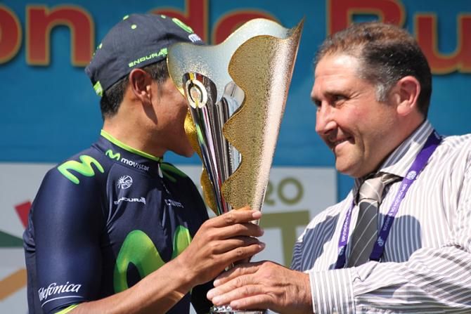 An almost artistic take of Nairo Quintana getting his winner trophy
