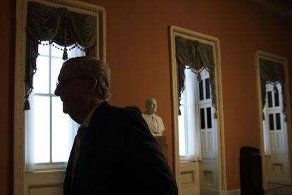 Mitch McConnell returns to his office at the Capitol