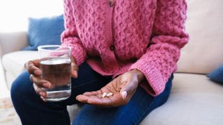 woman taking probiotics to lose weight