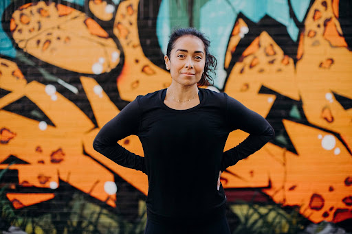 female running coach poses for picture