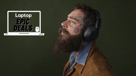 Recording artist Post Malone wearing black Sony WH-1000XM6 wireless headphones and a brown suede jacket with a denim blue shirt against a green background. 