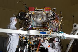 Experts assemble the Mars InSight lander in a clean room in January 2015 at Lockheed Martin Space Systems in Denver.