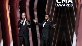 CMA Awards hosts Peyton Manning and Luke Bryan onstage in Nashville, Tennessee on November 9, 2022