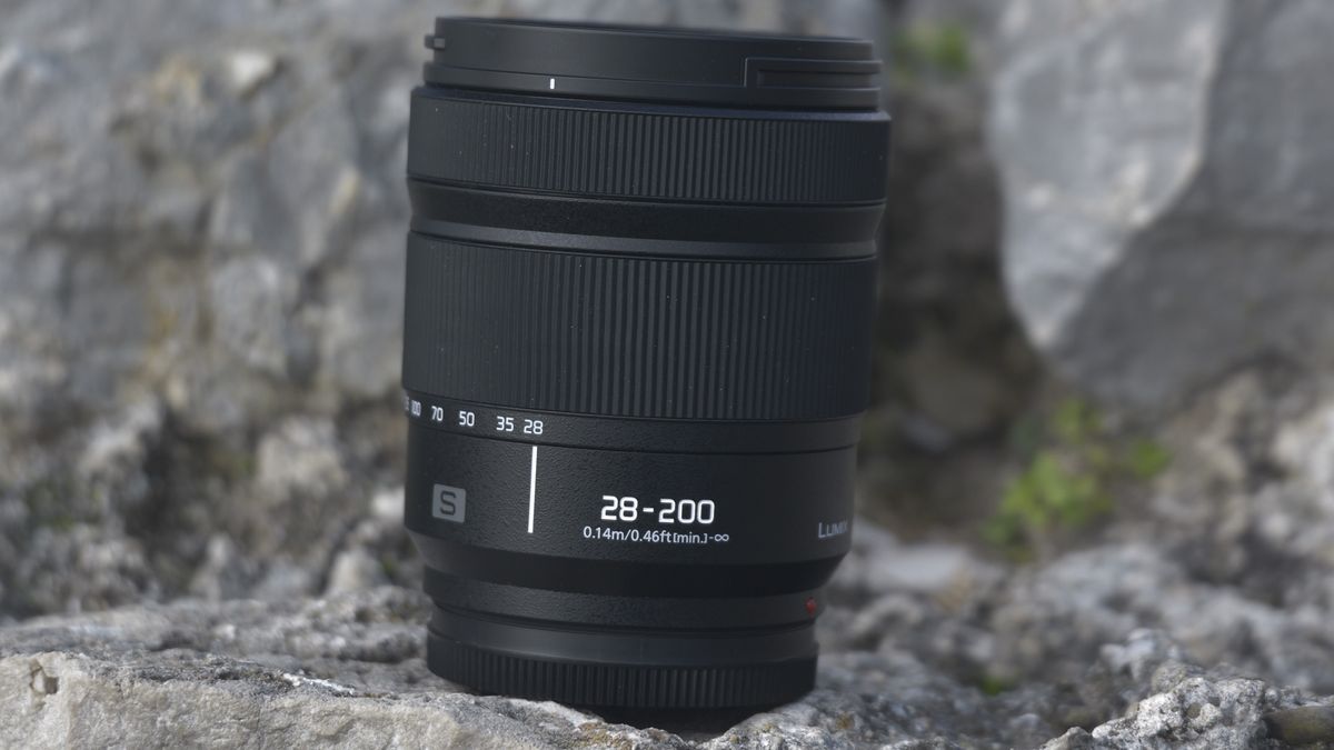 Panasonic LUMIX S 28-200mm F4-7.1 MACRO lens on a rock with barrel in closed position