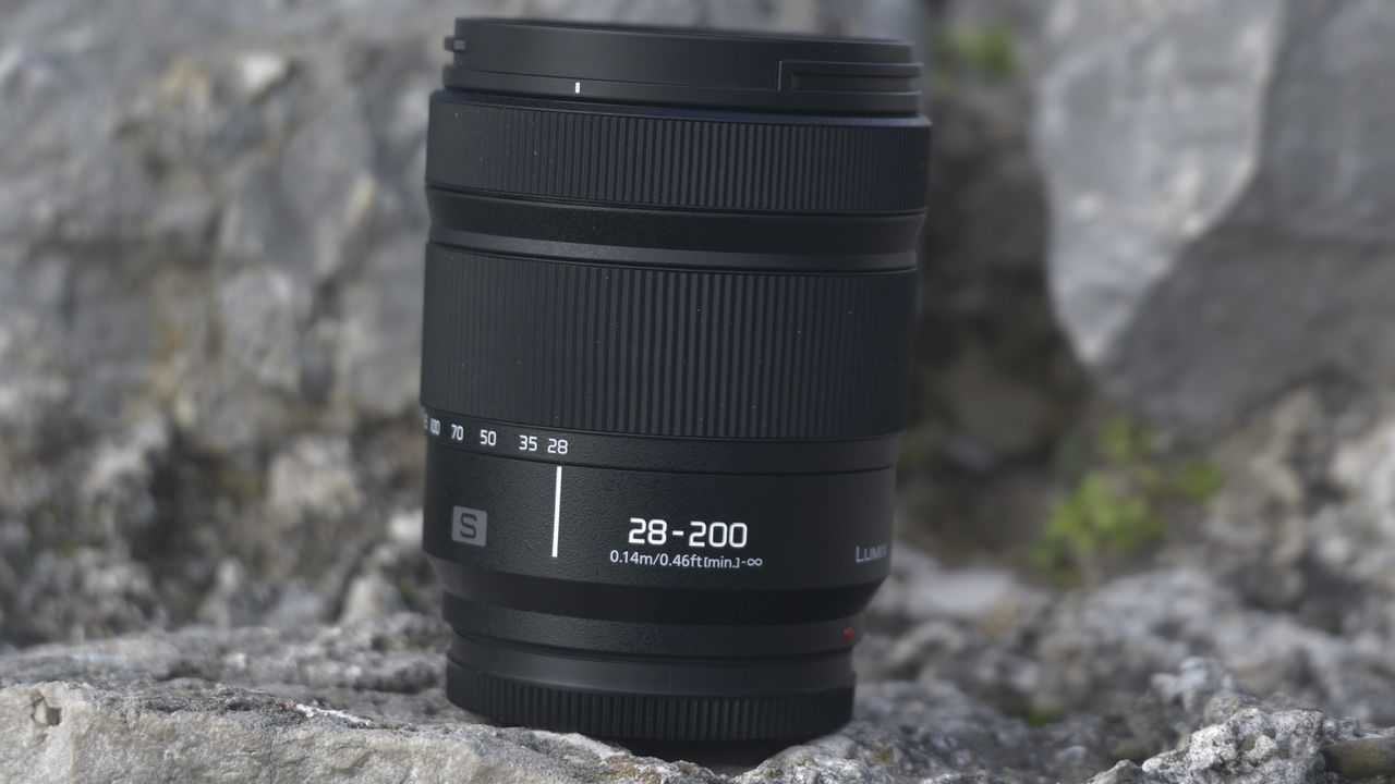 Panasonic LUMIX S 28-200mm F4-7.1 MACRO lens on a rock with barrel in closed position