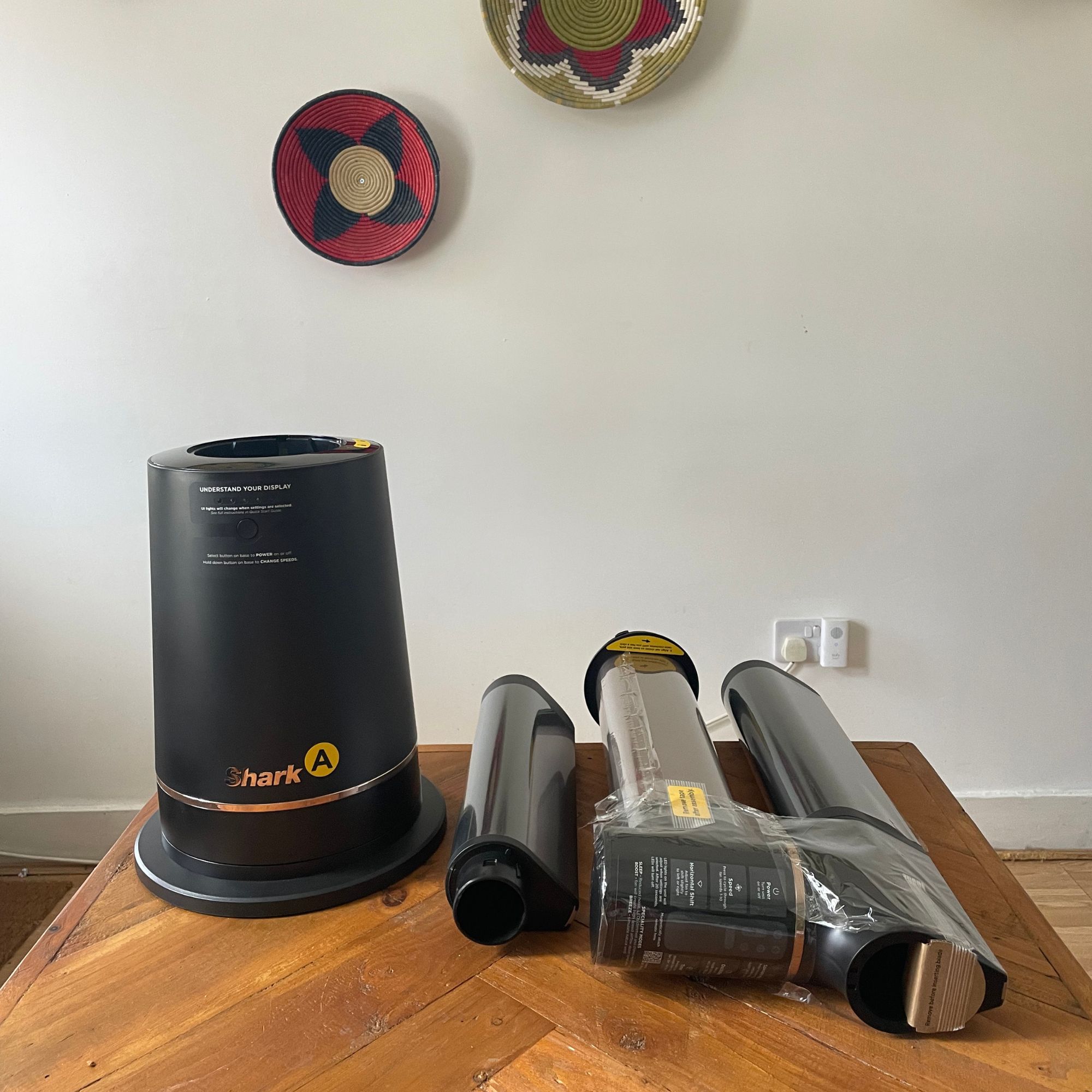 Shark TurboBlade fan components laid out on wooden table
