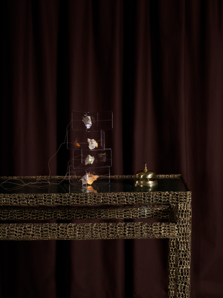 A series of images depicting brass-clad furniture, or sheeny coffee tables, in a lavish, luxury hotel-inspired setting.