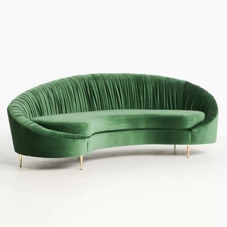 A green asymmetric velvet sofa