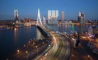 An aerial photo of the Erasmus bridge leading to De Rotterdam