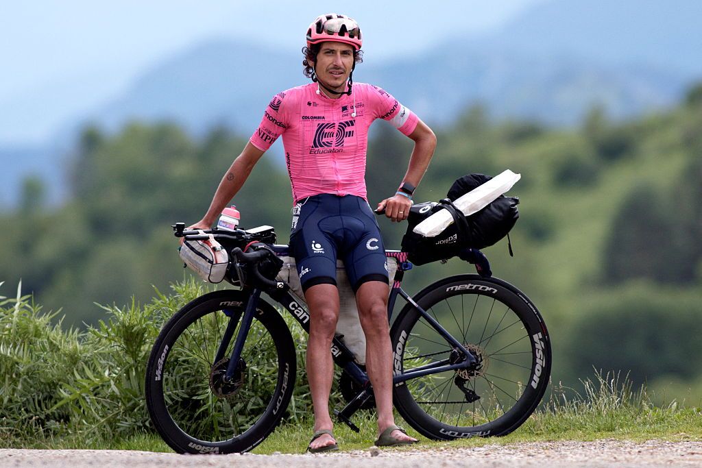 Australian cyclist Lachlan Morton poses as he takes a break at the Col-de-Port during the 13th day of his solo alternative Tour de France cycling race near Tarascon-sur-Ariege on July 8, 2021. Lachlan Morton is riding every kilometer of the Tour de France, plus the distances between race starts and finishes, solo. He stops at cafes for his food, and sleep under the stars at night. Morton is racing to raise money for World Bicycle Relief. (Photo by VALENTINE CHAPUIS / AFP)