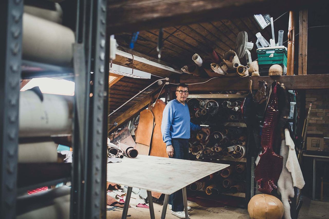 craftsman wearing blue sweater