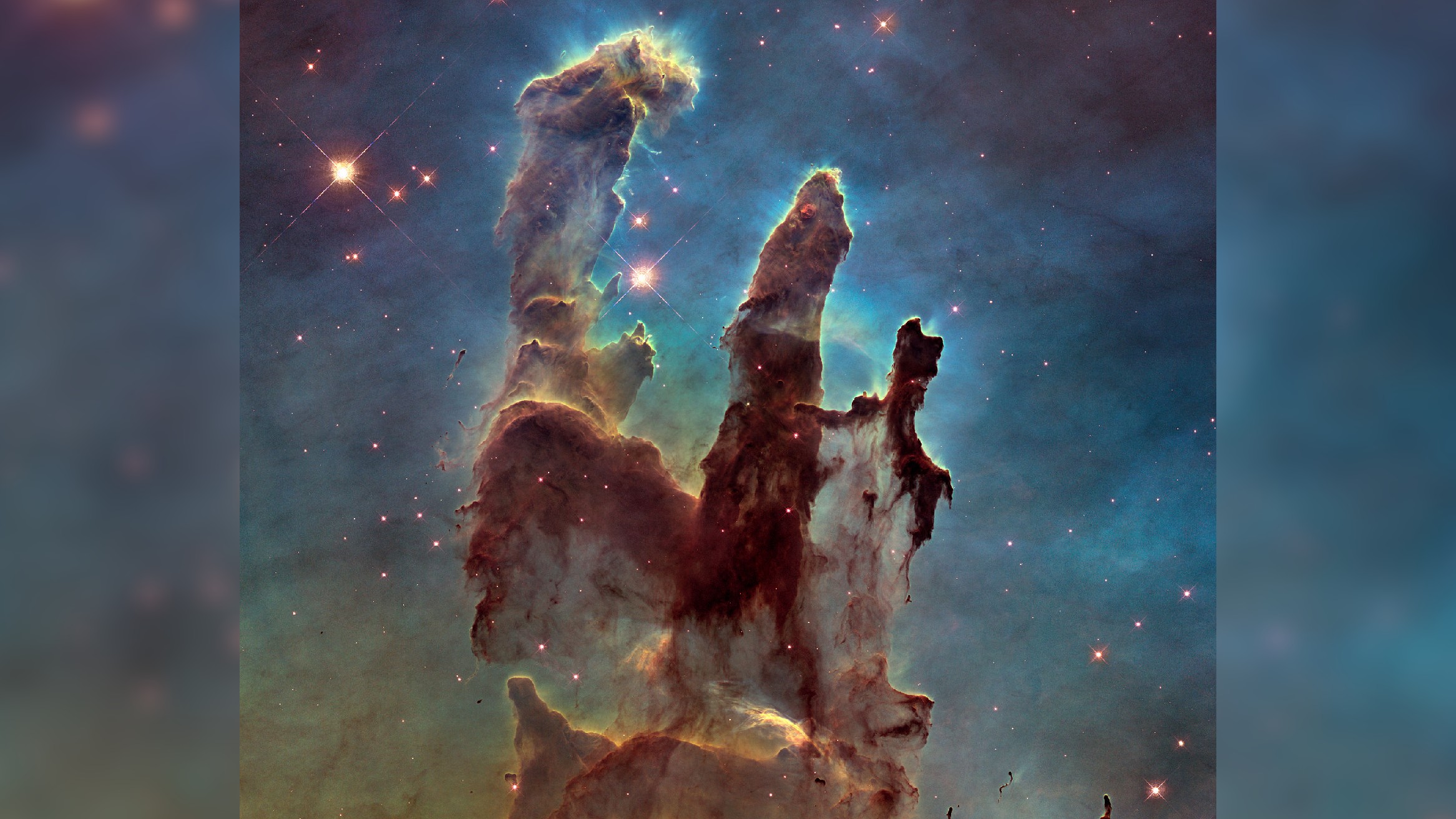 An image of the Pillars of Creation in the Eagle Nebula taken by the Hubble Space Telescope