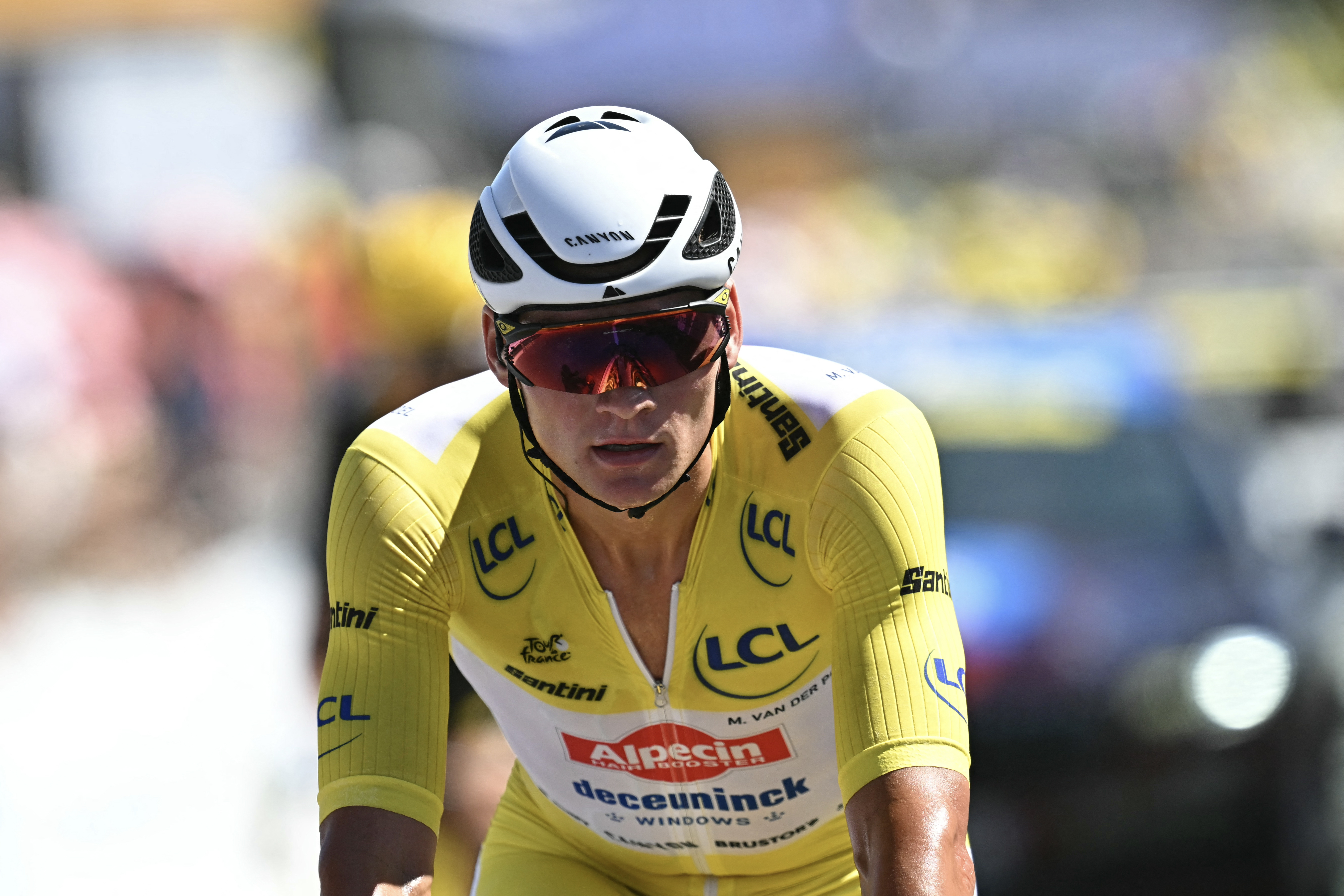 Alpecin - Deceuninck team&#039;s Dutch rider Mathieu van der Poel wearing the overall leader&#039;s yellow jersey cycles across the finish line cycles during the 7th stage of the 112th edition of the Tour de France cycling race, 197 km between Saint-Malo and Mur-de-Bretagne Guerledan, in Brittany, western France, on July 11, 2025. (Photo by Loic VENANCE / AFP) (Photo by LOIC VENANCE/AFP via Getty Images)