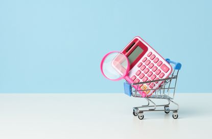 rendering of a grocery cart with a pink calculator and magnifying glass in it