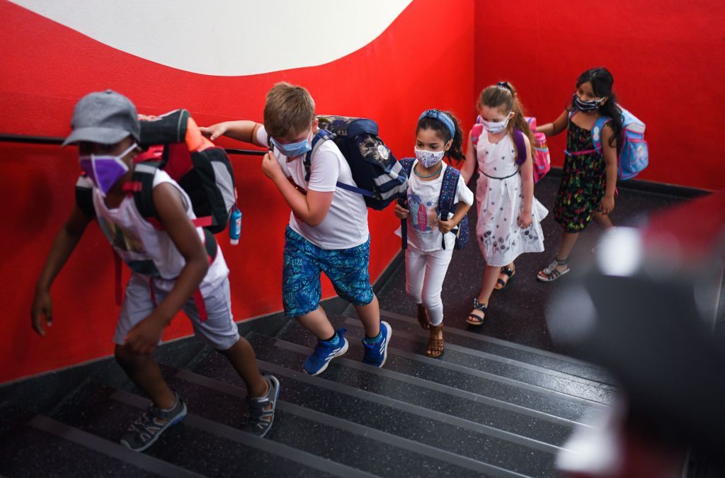 Children wearing masks.