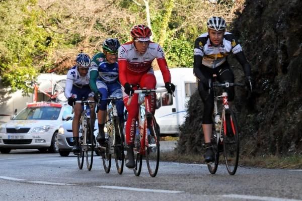 The four breakaway riders approach the day's second KOM line.