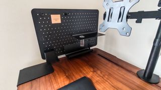 The walnut-finish EverDesk Max gets a black pegboard for extra storage