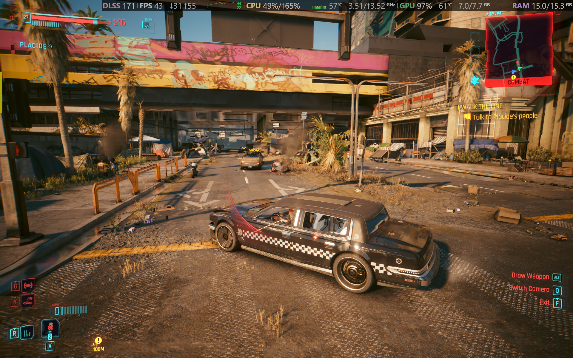 Cyberpunk 2077 gameplay screenshot showing car driving mechanics and UI elements running on an Alienware 15 laptop